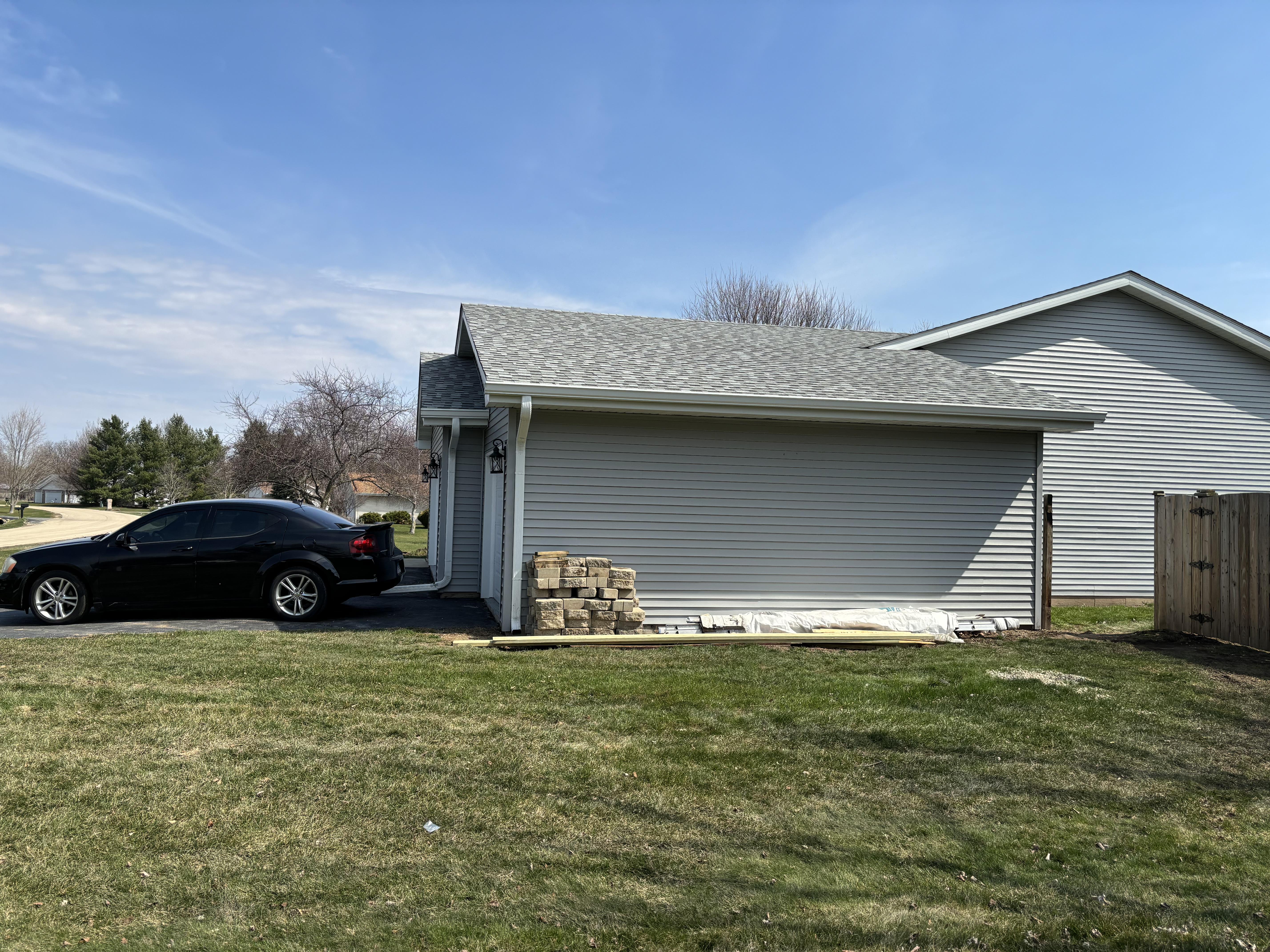 Completed seamless aluminum gutter installation on a two-story home