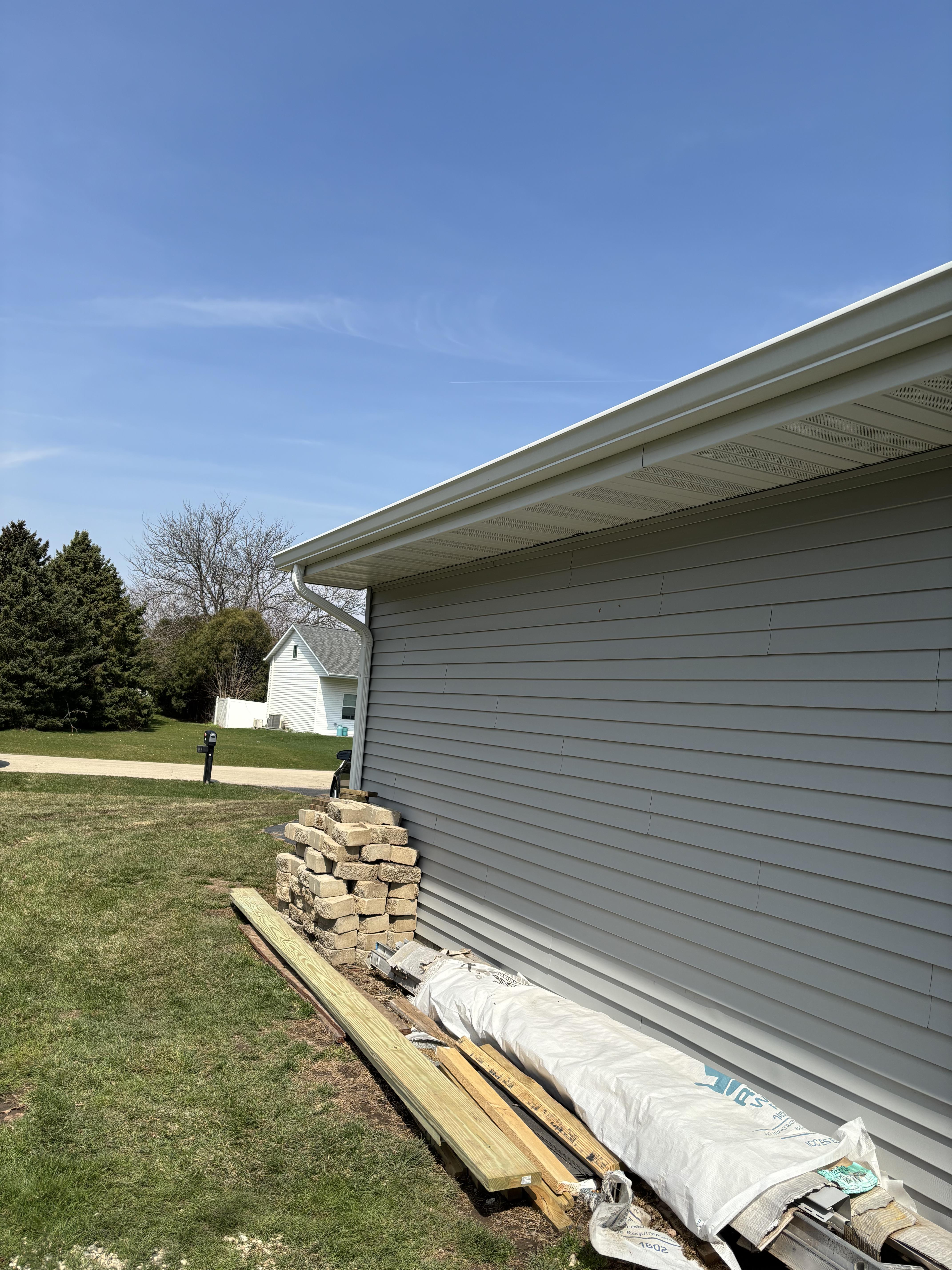 Close-up of new gutter corner joint installation